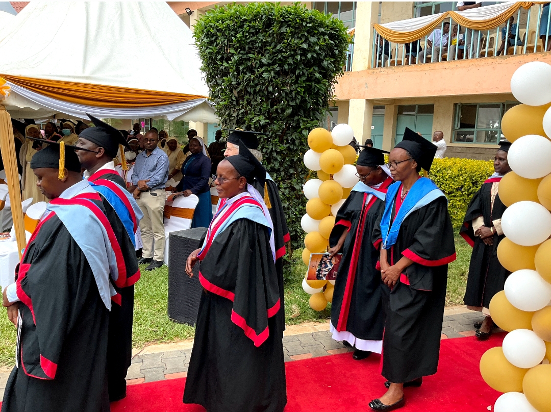Faculty procession in academic regalia on the red carpet